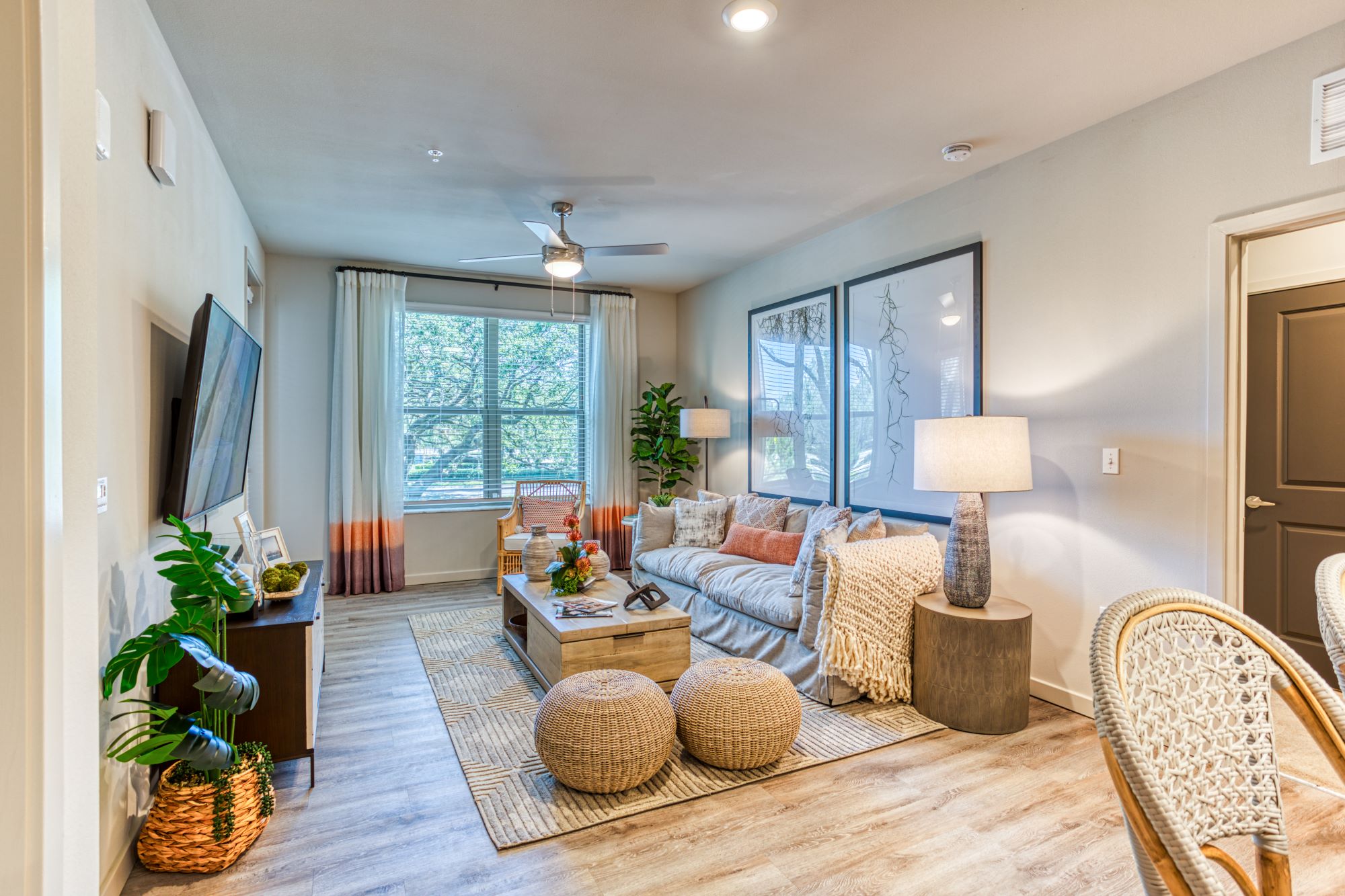 the living room of a home with a couch and a tv